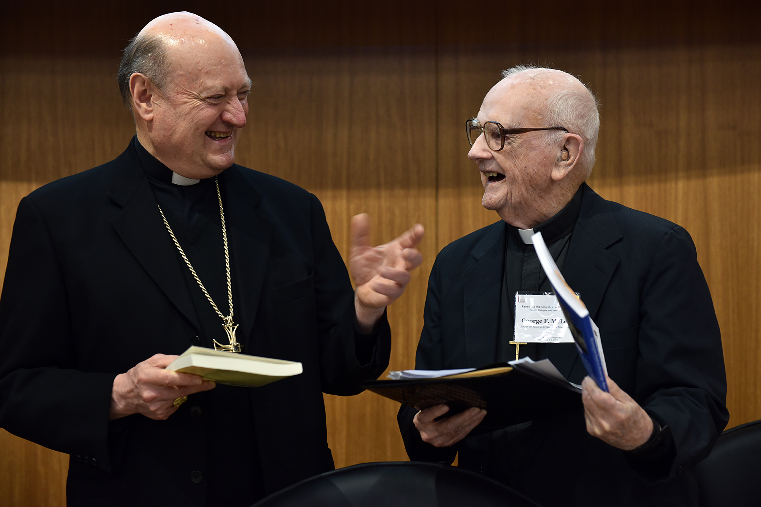 Father McLean sharing a joyful, laughter-filled scholarly moment with Cardinal Gianfranco Ravasi in Rome